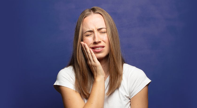 Girl suffering from toothpain